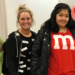 Maggie Granados (M&M shirt) poses with others for Halloween.
